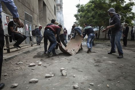 Protesters in Cairo, Egypt, collect rocks to throw at the advancing police (iStockphoto).